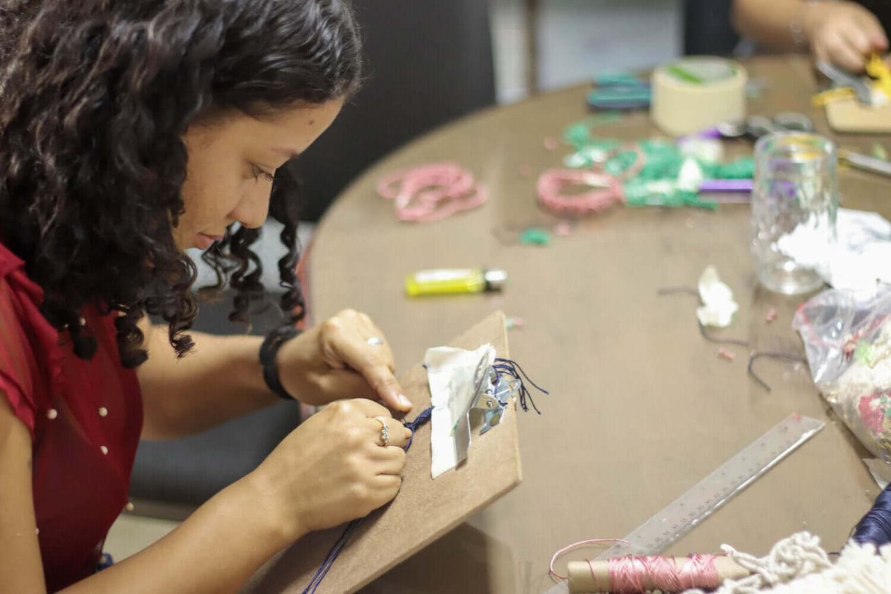 Knot Bound artisan making macrame